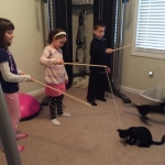 Guiness and Maleficent palying with kids